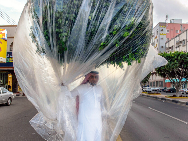 Artist Abdulnasser Gharem walks down the street