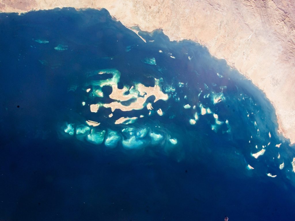 places to travel during Eid Al-Adha in Saudi Arabia: aerial view of sea and sand
