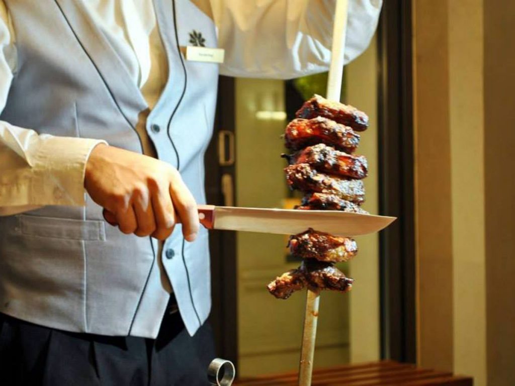 Saudi National Day 2022 buffets and brunches:  waiter carving grills 